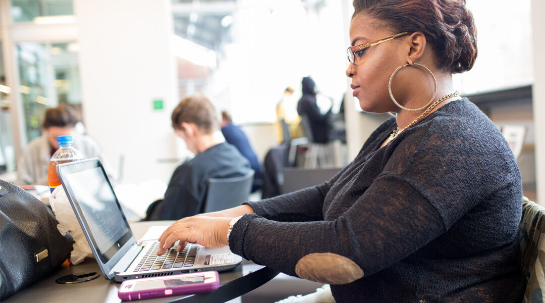 Person using a library laptop.