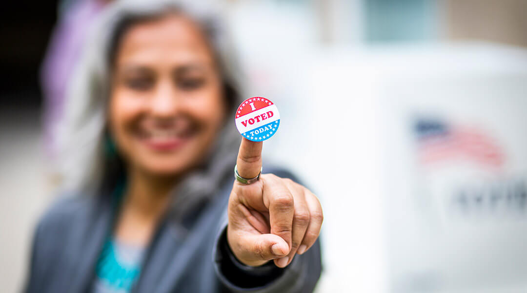 person displaying I Voted sticker