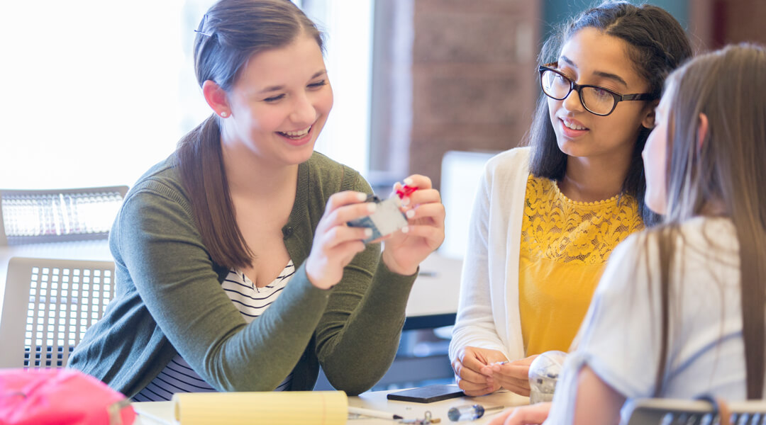 Three teens doing craft together