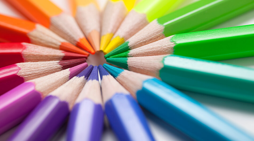 Colored pencils in a circle with their tips in the middle