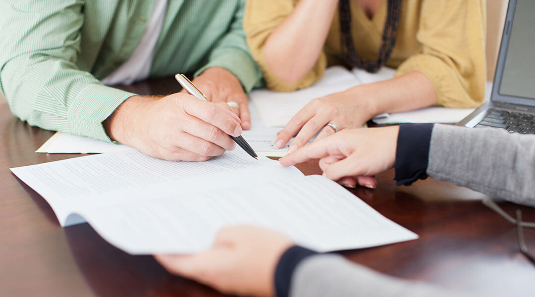 Couple Signing Contract