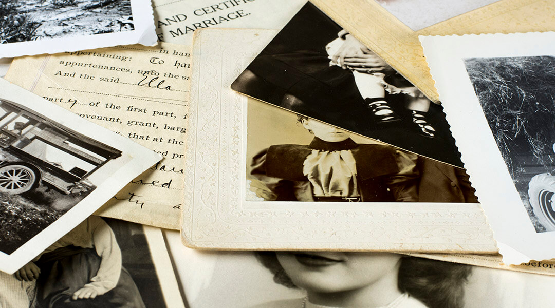 Genealogy family history theme with old family photos and documents.