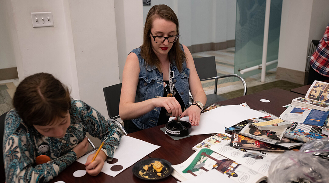Teens and library staff cut images out of magazines to create buttons.