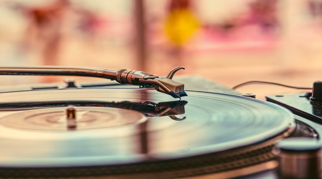 Close-up of a vinyl record being played on a turntable.
