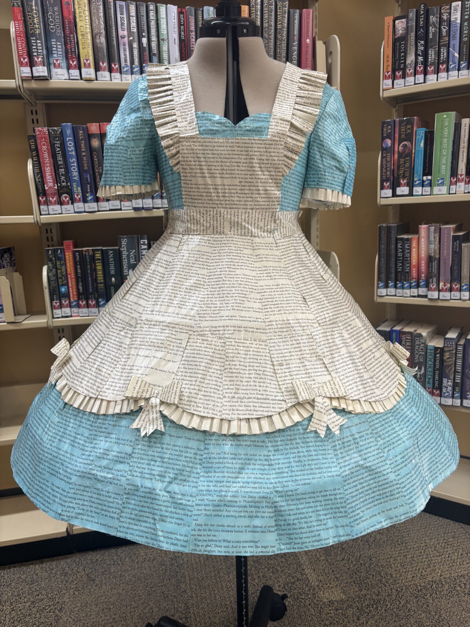 A blue and white dress replicating Alice's, made out of paper.