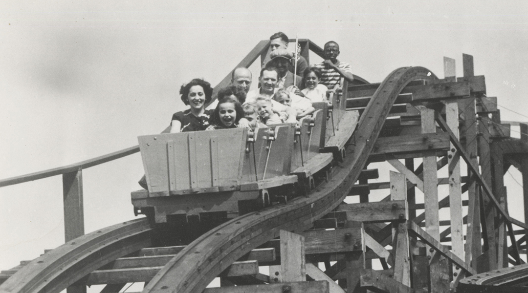 Black and white image of people on a wooden roller coaster at Kennywood.