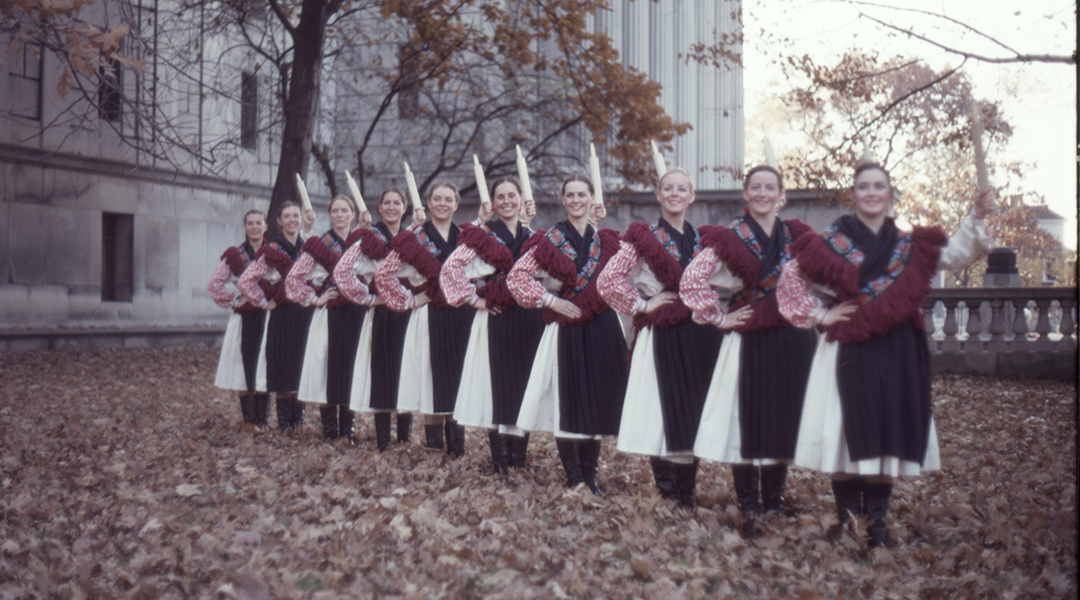 Vintage image of a group of women in matching uniforms posed in front of CLP Main