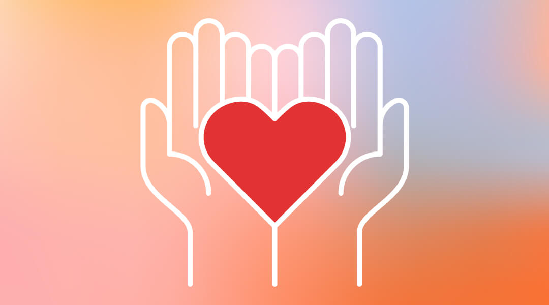 Symbol of a heart being held by two hands