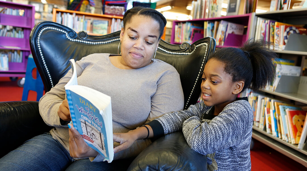 Mother and daughter reading in Carnegie Library of Pittsburgh