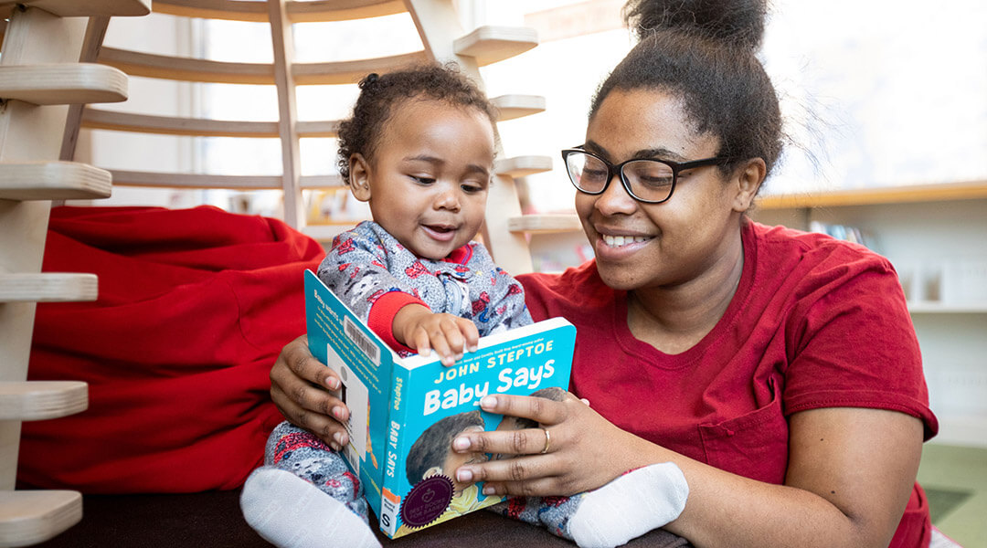 A mother reading to her baby