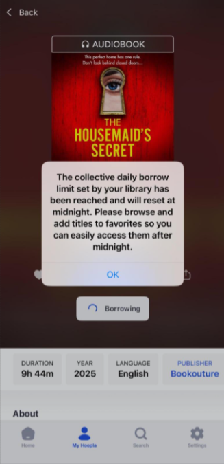 Screencap of an audiobook on Hoopla with pop-up notification reading "The collective daily borrow limit set by your library has been reached and will reset at midnight. Please browse and add titles to favorites so you can easily access them after midnight."