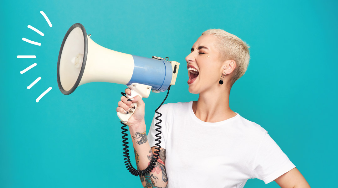 An adult yells into a megaphone